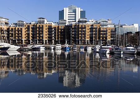Boats Moored In Up-Market Marina At St Katharine's Dock; London, England, Uk View Large Photo Image Stock Photograph - Boats Moored In Up-Market Marina At St Katharine's Dock; London, England, Uk. Fotosearch