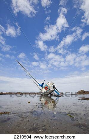 Picture - Boats moored on the North Brittany coast near Plougrescant on th Cotes D'Armor, France. Fotosearch