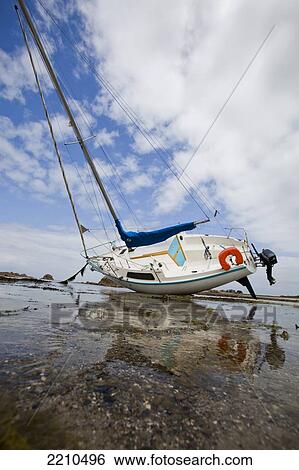 Stock Photograph - Boats moored on the North Brittany coast near Plougrescant on th Cotes D'Armor, France. Fotosearch