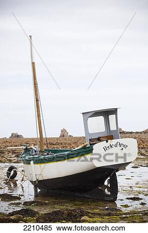 Stock Photography - Boats moored on the North Brittany coast near Plougrescant on th Cotes D'Armor, France. Fotosearch