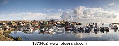 Stock Image - Boats Moored On The Water Along The Shoreline; Saltburn, Teesside, England. Fotosearch