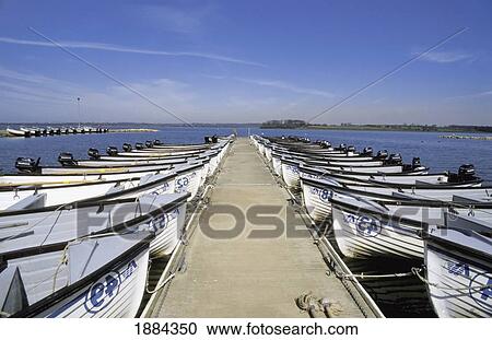 Stock Image - Boats Moored To Dock On Coastline. Fotosearch