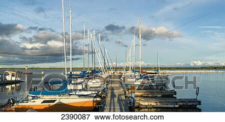 Stock Photo - Boats mooring along a dock in Hecla-Grindstone Provincial Park; Riverton, Manitoba, Canada. Fotosearch