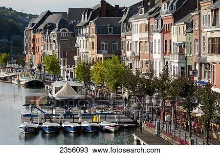 Stock Image - Boats mooring along a river; Dinant, Ardennes, Belgium. Fotosearch