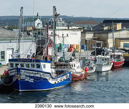 Stock Image - Boats mooring in a row along the waterfront; Bonavista, Newfoundland and Labrador, Canada. Fotosearch