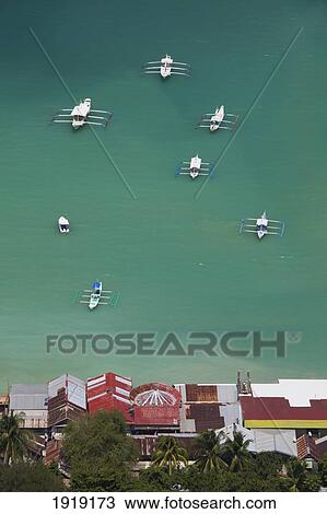 Stock Image - Boats Off Shore Of Tropical Island; El Nido, Palawan, Philippines. Fotosearch