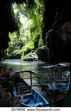 Stock Image - Boats On A River; Green Canyon Pangandaran Java Indonesia. Fotosearch