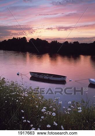 Stock Image - Boats On Canal At Sunset. Fotosearch