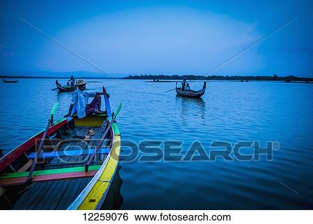 Boats on lake near U Bein Bridge; Mandalay, Myanmar View Large Photo Image Stock Photograph - Boats on lake near U Bein Bridge; Mandalay, Myanmar. Fotosearch