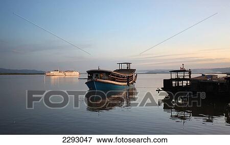 Stock Photo - Boats on river; Burma/Myanmar. Fotosearch