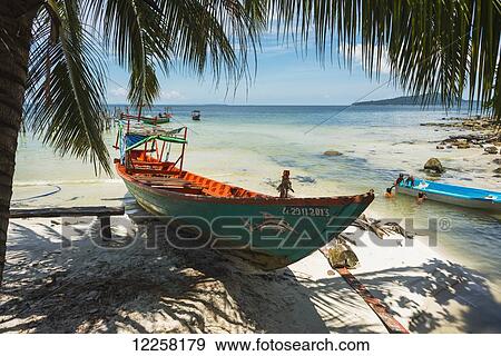 Boats on the white sand shore of Koh Rong Island; Sihanoukville, Cambodia View Large Photo Image Stock Photo - Boats on the white sand shore of Koh Rong Island; Sihanoukville, Cambodia. Fotosearch