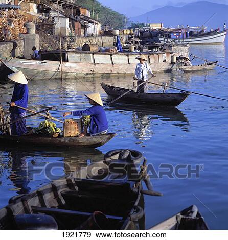 Stock Photo - Boats Riverfront Market Danang Vietnam. Fotosearch