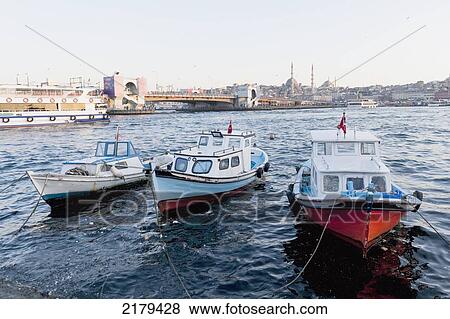 Boats Tied To The Shore In The Bosphorus River; Istanbul Turkey View Large Photo Image Stock Photo - Boats Tied To The Shore In The Bosphorus River; Istanbul Turkey. Fotosearch