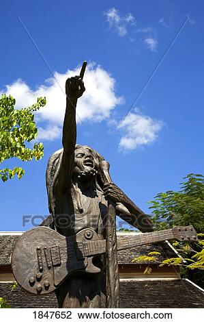 Stock Image - Bob Marley Statue By Christopher Gonzales; Island Village Entertainment Complex, Ocho Rios, St. Ann's Parish, Jamaica, Caribbean. Fotosearch