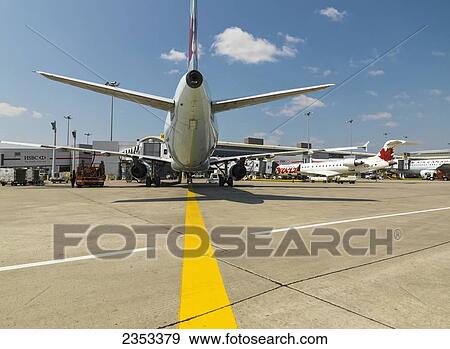 Boeing 737 Jet On The Tarmac At Pearson International Airport; Toronto, Ontario, Canada View Large Photo Image Stock Photo - Boeing 737 Jet On The Tarmac At Pearson International Airport; Toronto, Ontario, Canada. Fotosearch