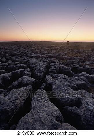 Boulder On Limestone Pavement At Dusk, Twisleton Scars Near Ingleton, Yorkshire Dales National Park, North Yorkshire, England. View Large Photo Image Stock Image - Boulder On Limestone Pavement At Dusk, Twisleton Scars Near Ingleton, Yorkshire Dales National Park, North Yorkshire, England.. Fotosearch