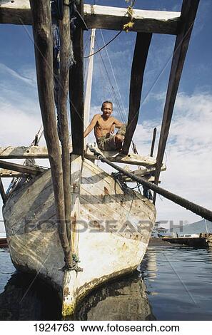 Stock Image - Boutonese Sailor And Trading Boat. Fotosearch