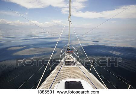 Stock Image - Bow Of The Yacht Sailing Through Calm Waters. Fotosearch