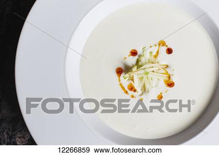 Bowl of cream of mushroom soup garnished with apple and oil; Ontario, Canada View Large Photo Image Stock Photo - Bowl of cream of mushroom soup garnished with apple and oil; Ontario, Canada. Fotosearch