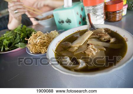Stock Photo - Bowl Of Noodles In Restaurant, Laos. Fotosearch