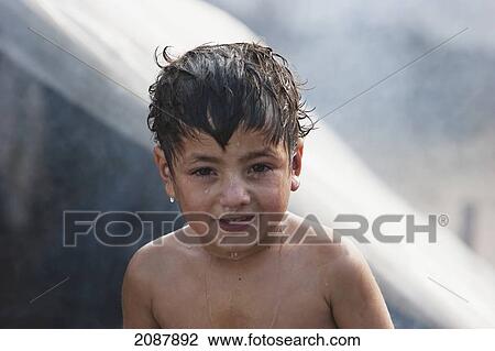 Stock Image - Boy After A Wash In A Relief Camp After The 8 October 2005 Earthquake, Muzaffarabad, Azad Kashmir, Pakistan. Fotosearch
