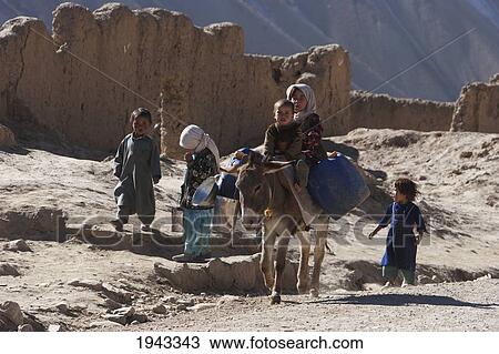 Boy And Girl On A Donkey In Bamiyan, Bamian Province, Afghanistan View Large Photo Image Stock Image - Boy And Girl On A Donkey In Bamiyan, Bamian Province, Afghanistan. Fotosearch