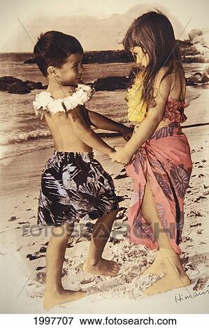 Boy And Girl On Beach With Flower Leis, Hold Hands And Face Each Other View Large Photo Image Stock Photo - Boy And Girl On Beach With Flower Leis, Hold Hands And Face Each Other. Fotosearch