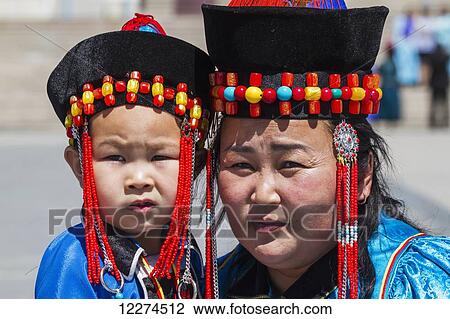 Boy and woman wearing Buryat traditional dress on S? khbaatar Square, Ulaanbaatar (Ulan Bator), Mongolia View Large Photo Image Stock Image - Boy and woman wearing Buryat traditional dress on S? khbaatar Square, Ulaanbaatar (Ulan Bator), Mongolia. Fotosearch