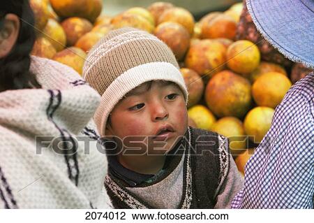Stock Image - Boy At A Market, La Paz, Bolivia. Fotosearch