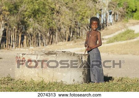 Boy At A Water Well Near Mangily, Toliara Province, Madagascar View Large Photo Image Stock Image - Boy At A Water Well Near Mangily, Toliara Province, Madagascar. Fotosearch