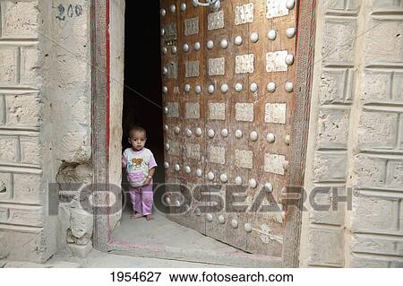 Boy at the door, Timbuktu, Mali View Large Photo Image Stock Photo - Boy at the door, Timbuktu, Mali. Fotosearch