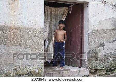 Stock Photo - Boy By The Door Of His Home, Coroico, La Paz Department, Bolivia. Fotosearch