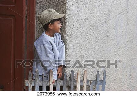 Stock Photograph - Boy By The Door Of His Home, Coroico, La Paz Department, Bolivia. Fotosearch