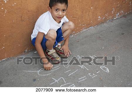 Stock Photo - Boy Doing Math On The Street, Antigua, Sacatep. Fotosearch