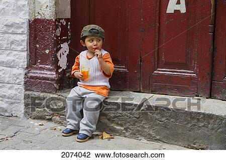 Boy Eating A Desert, La Paz, Bolivia View Large Photo Image Stock Image - Boy Eating A Desert, La Paz, Bolivia. Fotosearch