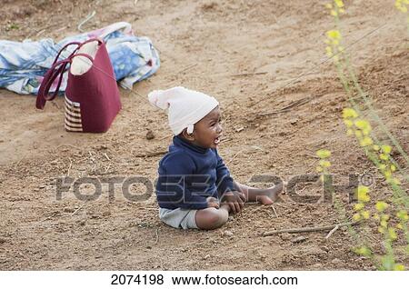 Boy In A Field Along The Road Between Ranohira & Ambalavao, Fianarantsoa Province, Madagascar View Large Photo Image Stock Photo - Boy In A Field Along The Road Between Ranohira & Ambalavao, Fianarantsoa Province, Madagascar. Fotosearch