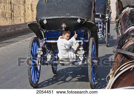 Boy On The Back Of A Horse Carriage, Edfu, Aswan, Egypt View Large Photo Image Stock Image - Boy On The Back Of A Horse Carriage, Edfu, Aswan, Egypt. Fotosearch