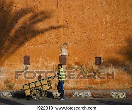Boy Pushing Cart Through Mellah Area, Marrakesh, Morocco View Large Photo Image Stock Image - Boy Pushing Cart Through Mellah Area, Marrakesh, Morocco. Fotosearch