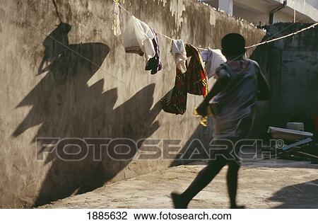Boy Running Past Washing Line View Large Photo Image Stock Image - Boy Running Past Washing Line. Fotosearch