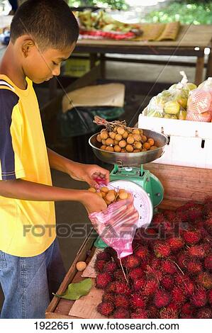 Boy Selling Fruit At Roadside Stall View Large Photo Image Stock Image - Boy Selling Fruit At Roadside Stall. Fotosearch