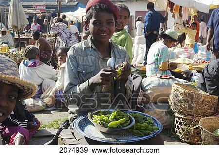Boy Selling Peppers At The Weekly Market In Fianarantsoa, Madagascar View Large Photo Image Stock Photo - Boy Selling Peppers At The Weekly Market In Fianarantsoa, Madagascar. Fotosearch