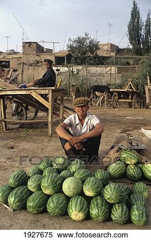 Boy Selling Watermelons At A Market (Ancient Silk Road/ Route) View Large Photo Image Stock Photography - Boy Selling Watermelons At A Market (Ancient Silk Road/ Route). Fotosearch