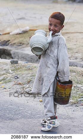 Boy Sucking On A Water Jar, Talechi, Northern Areas, Pakistan View Large Photo Image Stock Photo - Boy Sucking On A Water Jar, Talechi, Northern Areas, Pakistan. Fotosearch
