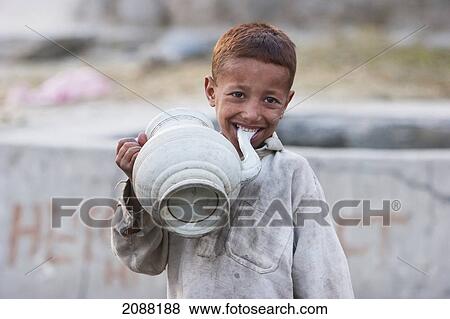 Boy Sucking On A Water Jar, Talechi, Northern Areas, Pakistan View Large Photo Image Stock Photo - Boy Sucking On A Water Jar, Talechi, Northern Areas, Pakistan. Fotosearch