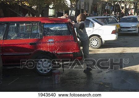 Boy Washing A Car In Charikar, Parwan Province, Afghanistan View Large Photo Image Stock Image - Boy Washing A Car In Charikar, Parwan Province, Afghanistan. Fotosearch