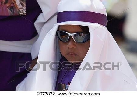 Boy Wearing Purple As A Sign Of Mourning At The Procession Of The Holy Cross On Good Friday In Antigua Guatemala, Sacatep View Large Photo Image Stock Image - Boy Wearing Purple As A Sign Of Mourning At The Procession Of The Holy Cross On Good Friday In Antigua Guatemala, Sacatep. Fotosearch