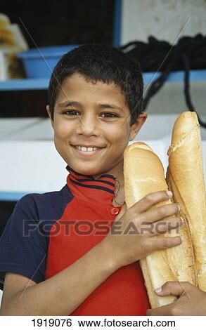 Boy With Baguettes. á View Large Photo Image Stock Photograph - Boy With Baguettes. á. Fotosearch