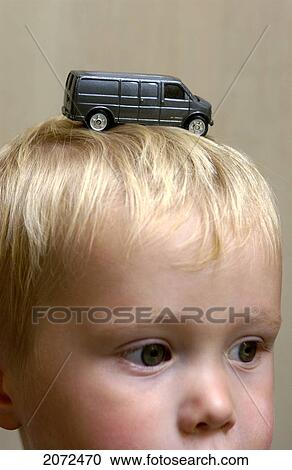 Boy With Toy Car On His Head View Large Photo Image Stock Image - Boy With Toy Car On His Head. Fotosearch