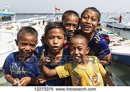 Boys at the Paotere fish market, Makassar (Ujung Pandang), South Sulawesi, Indonesia View Large Photo Image Stock Photography - Boys at the Paotere fish market, Makassar (Ujung Pandang), South Sulawesi, Indonesia. Fotosearch