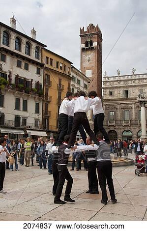Boys Performing A Traditional Dance On The Piazza Delle Erbe, Verona, Italy View Large Photo Image Stock Photo - Boys Performing A Traditional Dance On The Piazza Delle Erbe, Verona, Italy. Fotosearch
